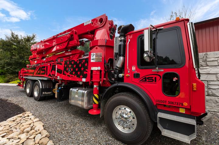 ASI Concrete Pumping boom truck, red with stars-and-stripes livery