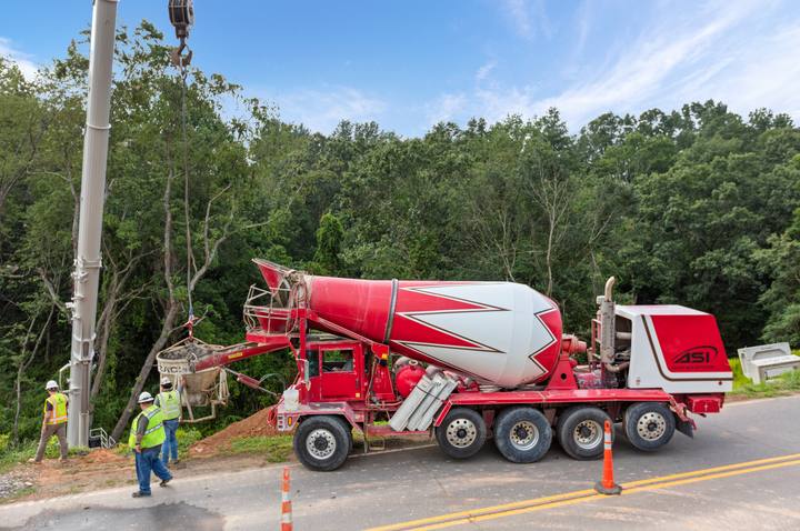ASI mixer filling a crane bucket on a tight-access pour